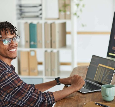 smiling-african-american-man-writing-programming-c-2021-09-24-04-09-47-utc.jpg